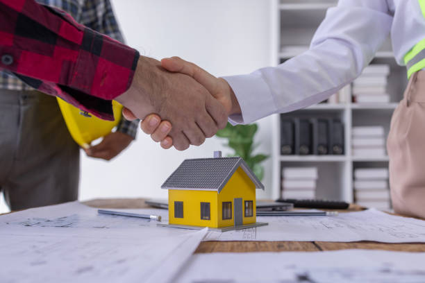 istock Real estate agents and construction team leaders work together. View house designs and renovate house plans. Construction projects. Mortgage, rent, buy, sell, buy, sell houses Engineer teams meeting. 1618004513