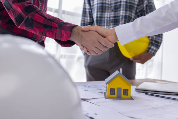istock Real estate agents and construction team leaders work together. View house designs and renovate house plans. Construction projects. Mortgage, rent, buy, sell, buy, sell houses Engineer teams meeting. 1618004516