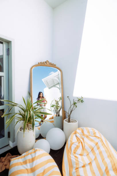 Woman reading a magazine in hotel room