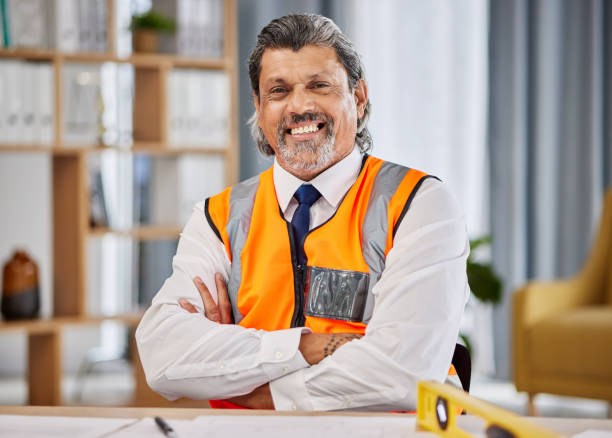 istock Architect, contractor and portrait of man in office for construction project management, development and planning property. Happy mature designer, building planner and engineering with arms crossed 1618071176