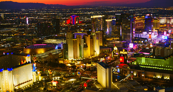 Las Vegas, Nevada/ USA - March 14, 2022: Aerial view of hotels along The Strip in Las Vegas at night.

Las Vegas is the largest city in the US state of Nevada and a world-renowned center for gambling, shopping, fine dining and entertainment. It is mainly famous for its many casinos and the accompanying entertainment-tourism activities, which earned it the nickname of the Entertainment Capital of the World.