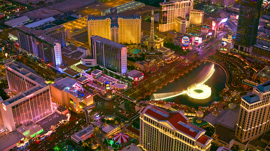 Las Vegas, United States - November 24, 2022: A picture of Las Vegas at night, showing the MGM Grand, the Tropicana Las Vegas - a DoubleTree by Hilton Hotel, and the top of the pyramid of the Luxor Hotel and Casino.