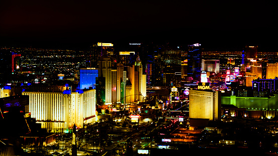 Las Vegas, NV - November 24, 2021: A gargoyle in focus overlooking the grounds of the famous Venetian Hotel and Casino, with the canal and gondolas in the distance.