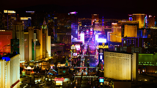 Las Vegas, Nevada/ USA - March 14, 2022: Aerial view of hotels on The Las Vegas Strip in city at night.

Las Vegas is the largest city in the US state of Nevada and a world-renowned center for gambling, shopping, fine dining and entertainment. It is mainly famous for its many casinos and the accompanying entertainment-tourism activities, which earned it the nickname of the Entertainment Capital of the World.