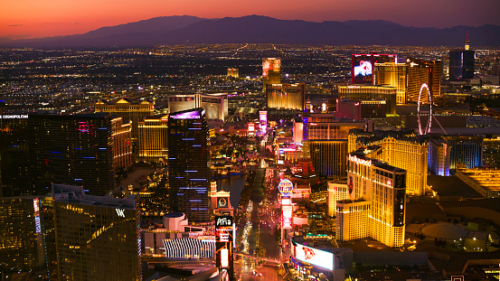 The Las Vegas strip at night with cars lined up on the road