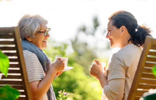 istock women drinking tea in the garden 1618086204