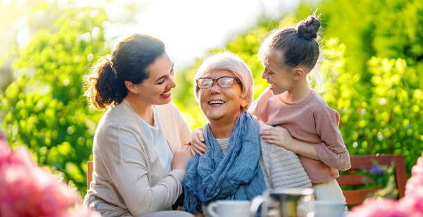 istock family drinking tea in the garden 1618090874