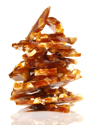 Caramel with Nuts - Pieces on white Background