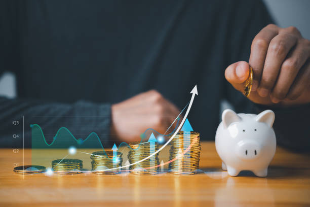 istock businessman saving money in a piggy bank while analyzing investment options on a digital chart 1618102729