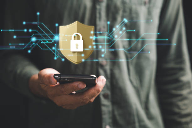 istock Ensure mobile privacy and security with a cybersecurity concept. Business professionals employ encryption and key icons on virtual interface shields to protect personal information on smartphones. 1618102740