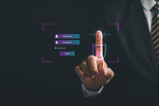 Pointing finger on a futuristic biometric identification fingerprint scanner. Surveillance and security scanning concept in cyber applications. Embrace the future of technology and secure information.