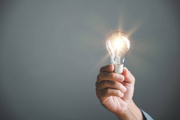 istock A hand holding a glowing light bulb, signifying the connection between creative ideas 1618103303