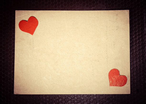 Postage stamp attached to a handwritten letter. Concept of traditional mail, communication, and correspondence.