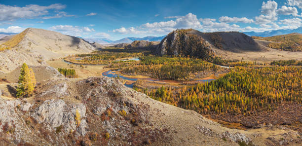 istock A river flows meandering along a picturesque valley, sunny autumn day, panoramic 1618132210