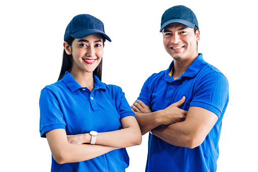 Portrait of smiling deliveryman and woman with crossed arms  in blue uniform isolated on white background
