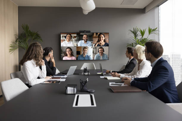 istock Office staff meeting with diverse team on online video conference 1618153693