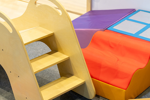 colorful padded and wooden stairs for kids to climb