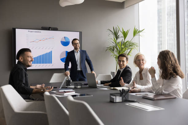 istock Happy different aged business team having fun on office meeting 1618153696