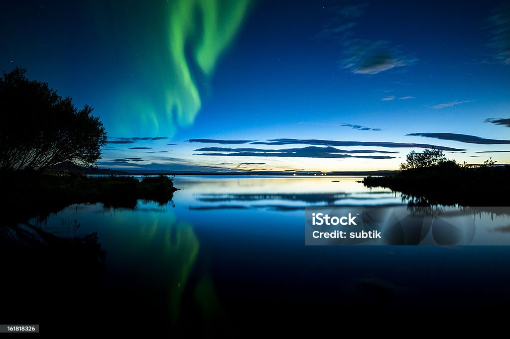 aurora borealis on iceland aurora borealis on iceland, lake myvatn, red tent in foreground Astronomy Stock Photo