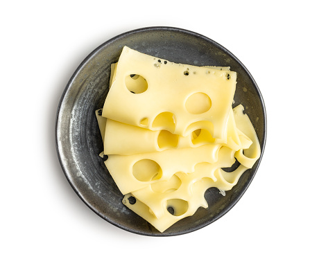 Slices of cheese on plate isolated on the white background.