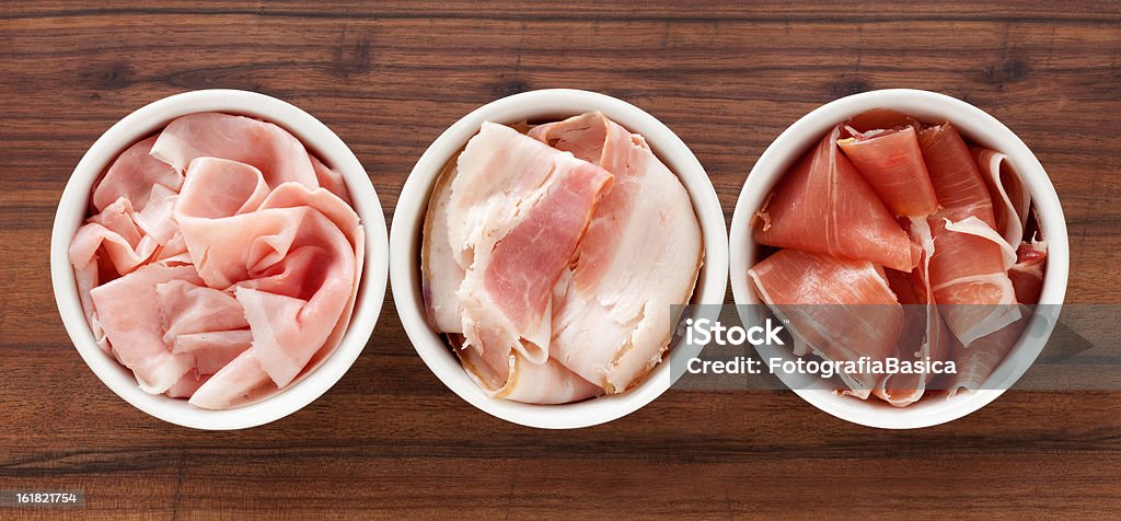 hams a fette - Foto stock royalty-free di Prosciutto