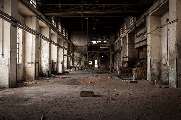 Old industrial building Old abandoned industrial building. Legacy of the main hall in foundry factory. the ruined city stock pictures, royalty-free photos & images