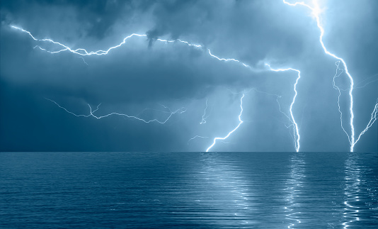 Beautiful sea landscape and storm beginning with lightning