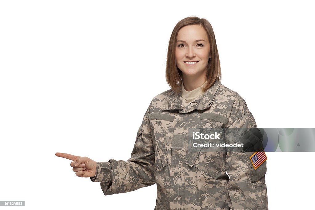 Female soldier pointing to her right A smiling soldier points her finger to the right Adult Stock Photo