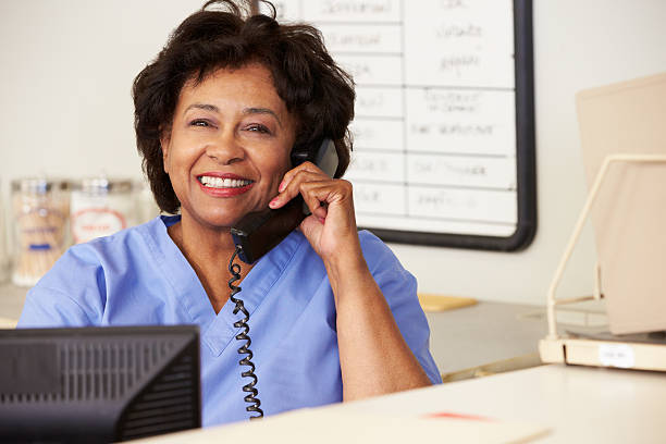 istock Nurse Making Phone Call At Nurses Station 161824863