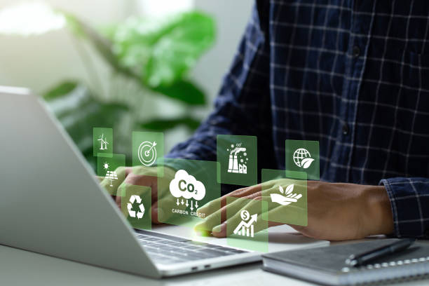 istock carbon credit concept. Man using a laptop to trade carbon credit on a virtual screen. carbon etf to invest in sustainable business. Carbon neutral balancing CO2 emission offset.Net zero emission.Esg 1618253046