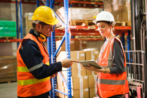 istock Industrial worker working at warehouse factory. 1618254203