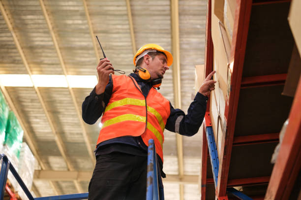 istock Industrial worker working at warehouse factory. 1618254492