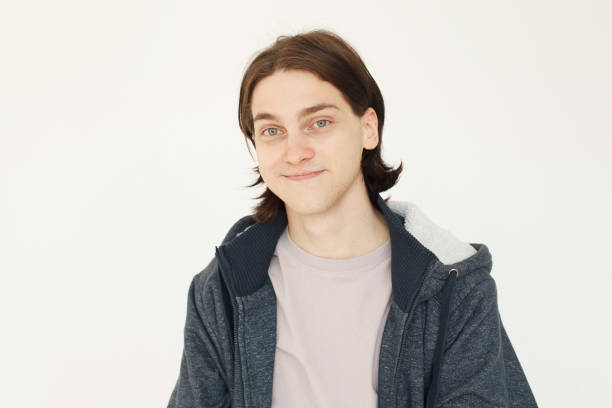 istock Cute young man looking at camera on white background 1618255591