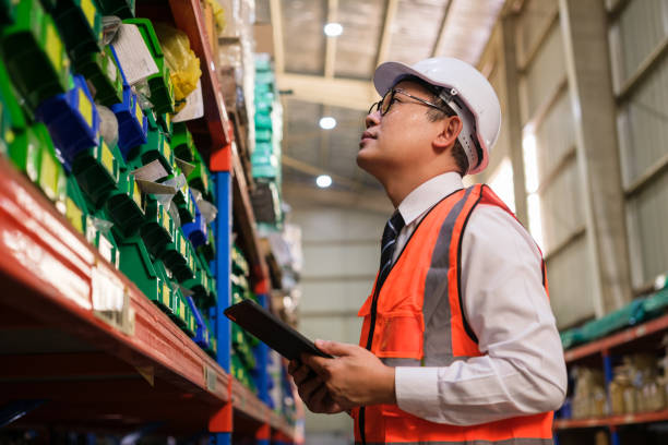 istock Industrial worker working at warehouse factory. 1618257872