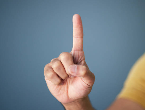 istock Man, hand and pointing up in studio with mockup for question, choice or vote on blue background. Product placement, finger showing deal announcement or information with mock up space for notification 1618263786