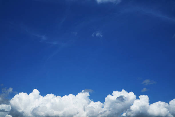 istock pure clear blue sky huge white gray cloud and sunlight.jpg 1618265502