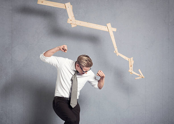istock Furious businessman in front of graph pointing down. 161826760