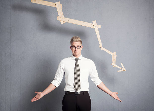 istock Discontented businessman in front of graph with negative trend. 161826777