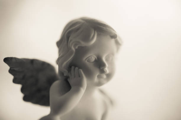 istock Cute angelic cupid statue. 1618272588