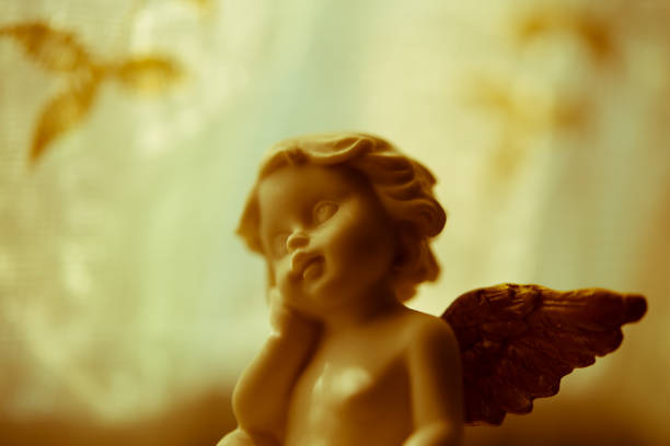 istock Cute angelic cupid statue. 1618272599
