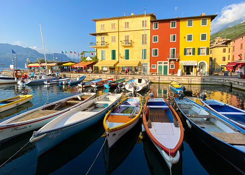 Castelletto, Italy, September, 18, 2020 - Old Port with fishing boats in Castelletto, Lake Garda