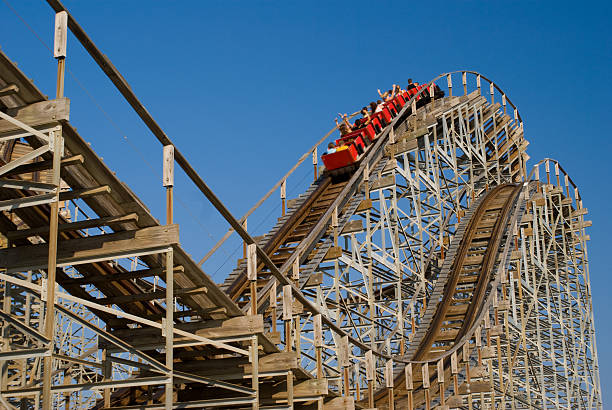 Wooden Rollercoaster Old wooden rollercoaster at an amusement park rollercoaster stock pictures, royalty-free photos & images