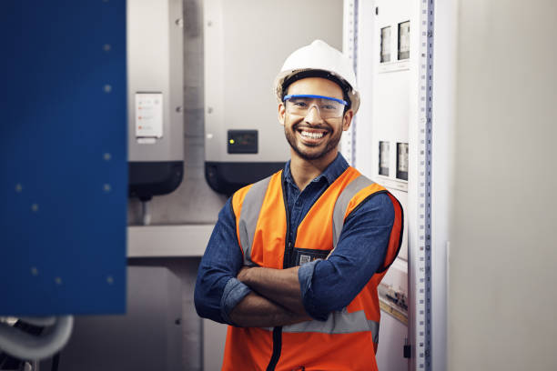 istock Portrait, happy man and engineering technician in control room, inspection service or industry maintenance. Electrician, arms crossed and smile in electrical substation, system or industrial mechanic 1618279649