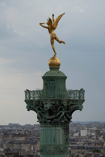 Paris, France-12 30 2020:The statue of Mercury riding pegasus at the entrance of the Tuileries garden in Paris, France by sculptor Charles Antoine Coysevox (1640-1720) who was a French sculptor in the Baroque and Style Louis XIV, best known for his sculpture decorating the gardens and Palace of Versailles and his portrait busts.