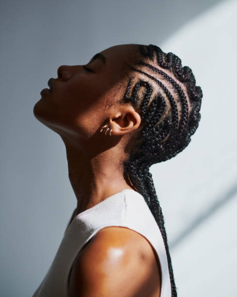 Breathless beauty, stock photo side profile shot of a beautiful black woman with cornrow braids, stock photo weaving stock pictures, royalty-free photos & images