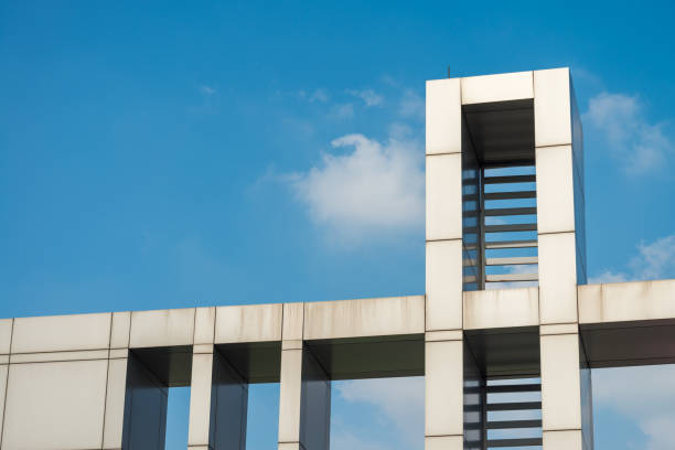 istock Detail of modern building architecture on rooftop with blue sky background. 1618293356