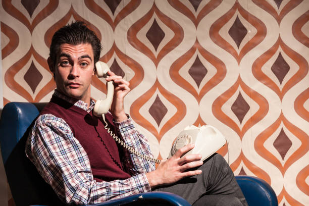 Man in Retro Room Answering at the Phone
