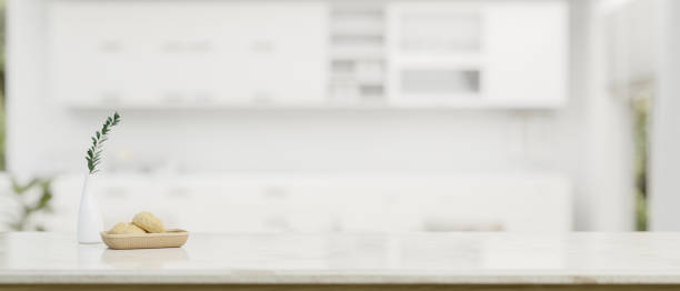 istock Copy space for displaying your product on a white tabletop over a blurred modern white kitchen 1618311958