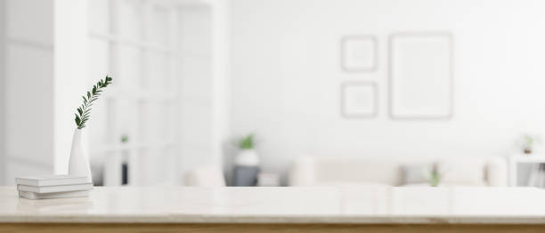 istock A modern white workspace with copy space over a blurred modern white living room 1618312501