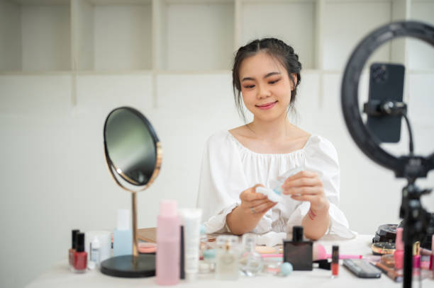 istock An attractive Asian female makeup artist recording her beauty makeup tutorial content in her studio. 1618314844